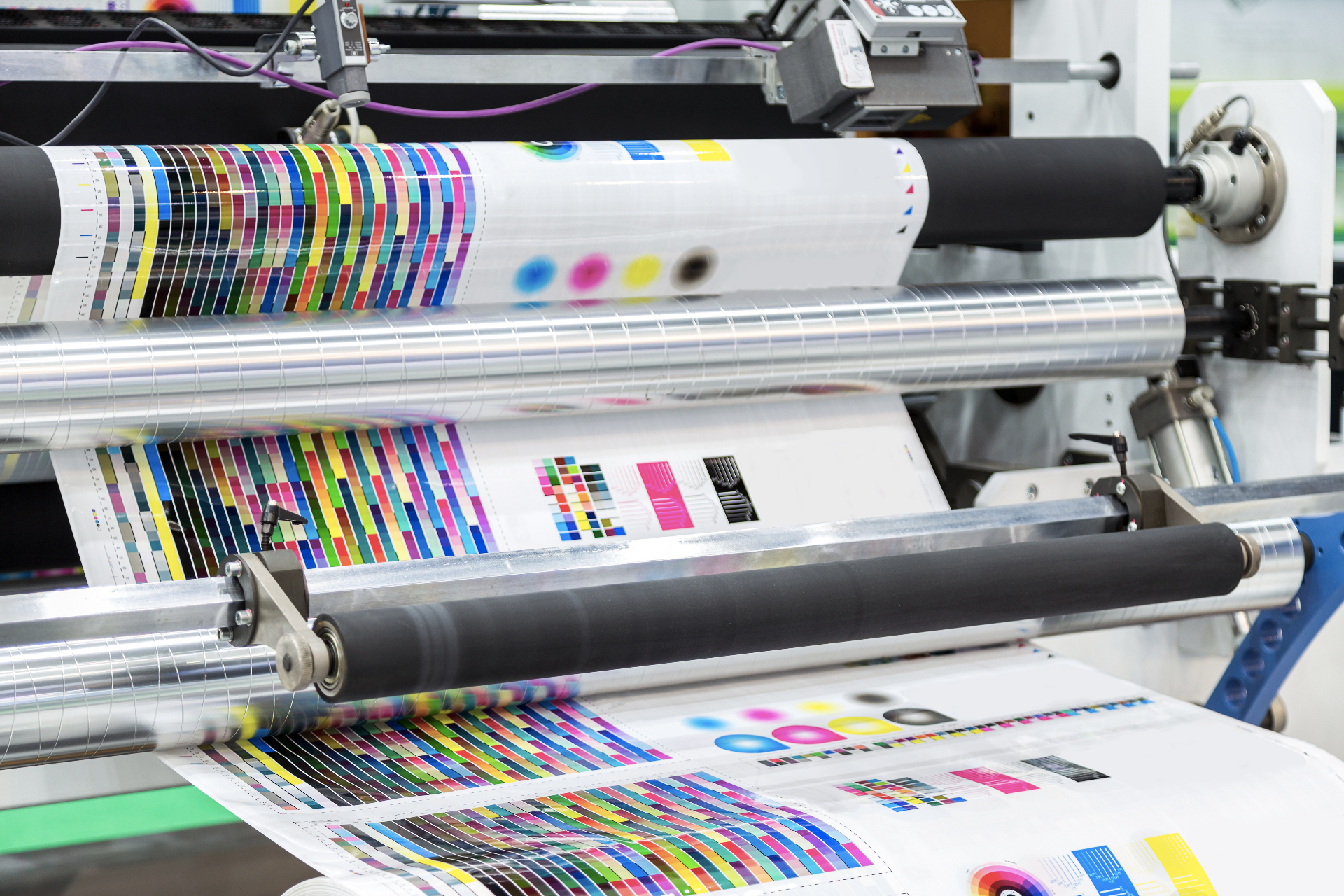 Color calibration bars on printed sheets rolling through the press